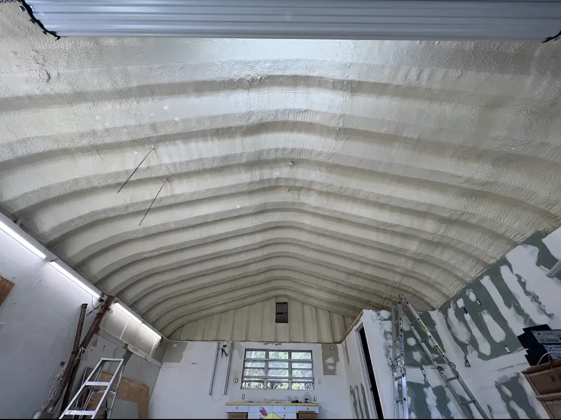 Spray polyurethane foam applied to the underside of a metal roof deck in Albertville